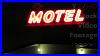 Vintage-Motel-Neon-Sign-At-Night-In-Red-Color-U0026-Old-Font-On-Building-Roof-Hd-Stock-Video-Footage-01-sloj