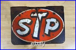 Vintage Original Pressed Tin STP Sign. The Sign Does Have Some Patina